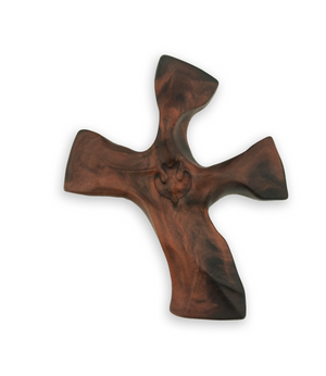Wooden cross with a detailed design on a white background