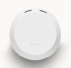 A white, round-shaped Pura 4 smart fragrance diffuser with a minimalist design.