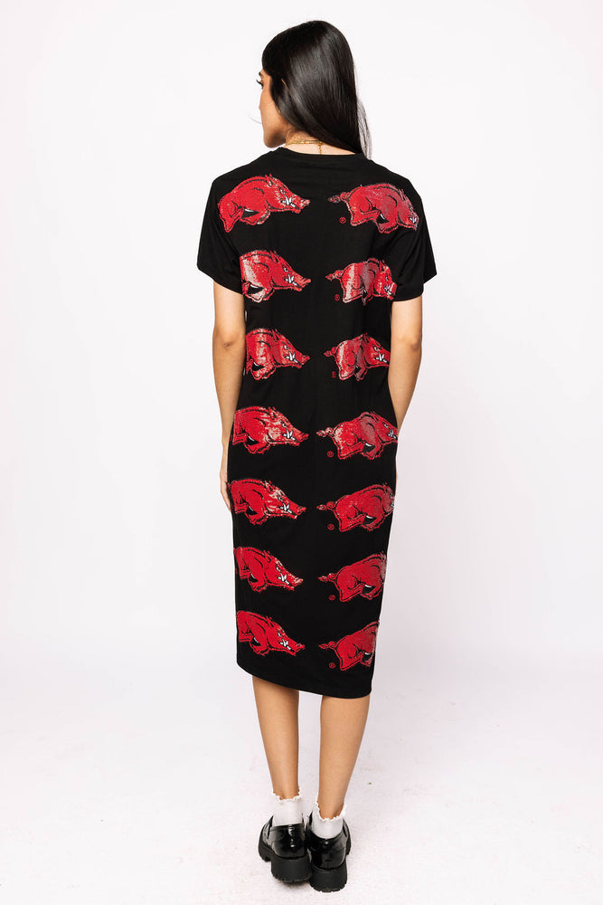 Black dress with red animal print worn by a person on a white background