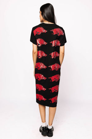 Black dress with red animal print worn by a person on a white background