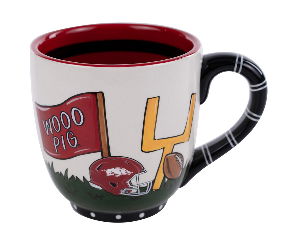 Decorative mug with football-themed design on a white background