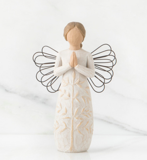 A faceless angel standing and praying.