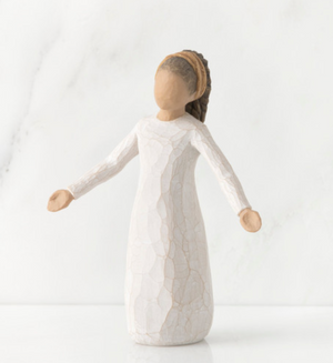 Textured white figurine on a light background