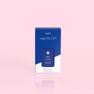 A Pura diffuser refill pack with Capri Blue branding, featuring a Volcano fragrance. The packaging is primarily blue and white.
